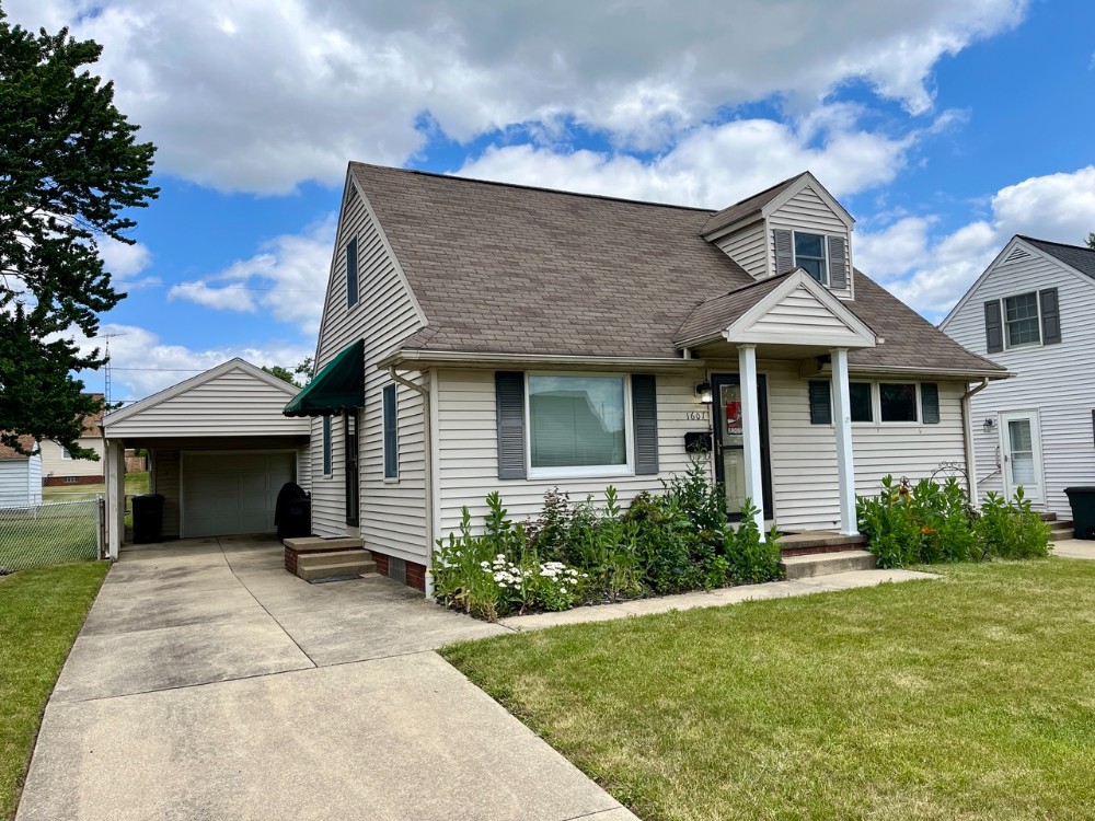 Kiko Realtors, Auctioneers, Advisors Clean Bungalow Home W/ Garage
